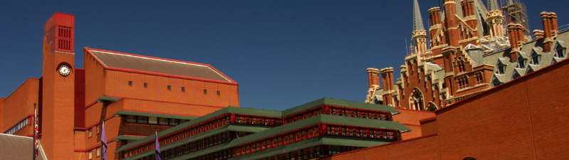 A photograph of The British Library, a 1960s red brick building, with the gothic St Pancras building in the background.