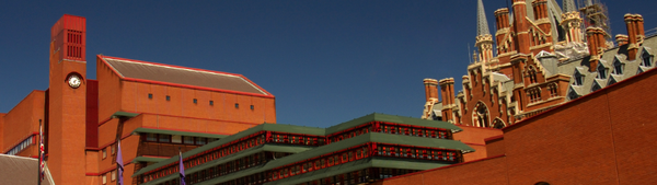 A photograph of The British Library, a 1960s red brick building, with the gothic St Pancras building in the background.